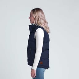 A navy puffa vest with a high collar and side pocket, featuring a small logo on the bottom.