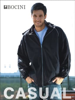 A black unisex reversible jacket with a zip and elastic cuffs, featuring a logo on the chest.