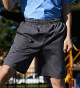 Boys’ grey school shorts with an elastic waistband, featuring a logo, suitable for casual wear.