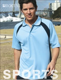 A light blue unisex polo shirt with navy accents and a logo, displayed on a model outdoors by a bridge.