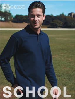 A navy long sleeve polo shirt with a collar, featuring a logo on the left side. The model is outdoors on grassy terrain.