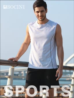 A man in a white sleeveless tank top with black accents stands by a railing, wearing black shorts. The image has a logo.