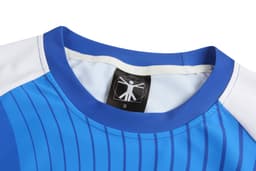 A blue athletics uniform tight featuring a white shoulder panel and a label with a logo inside.