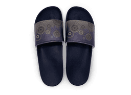 Navy slippers featuring a patterned strap with circular designs in shades of purple and gold.