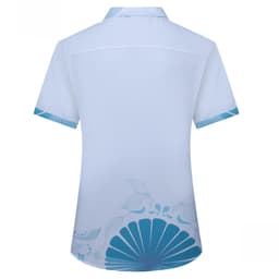 A light blue shirt featuring a teal design and a logo. The shirt has short sleeves and a collar.