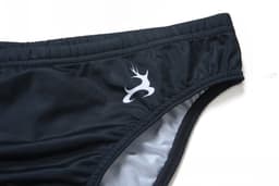 A black swimming brief featuring an anti-chlorine design and a logo on the side.