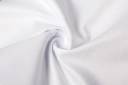 A white fabric with a smooth texture, arranged in a spiral pattern, showcasing its lightweight quality.