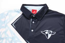 A navy and light blue polo shirt with a collar and an abstract design, featuring a logo on the chest.