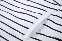 A white baseball/softball pant featuring black stripes and a visible pocket detail. Includes a logo.
