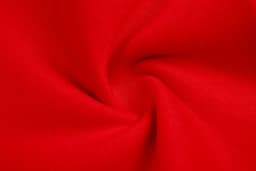 A red fleece fabric displaying a smooth, twisted texture. The material is soft and durable.