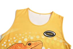 A yellow singlet featuring a detailed design of a frog and a logo.