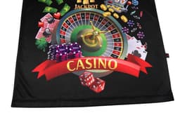 A black promotional product featuring a casino theme with roulette, cards, chips, and dice. It has a logo.