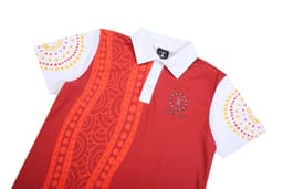 A red and white polo shirt featuring a patterned design and a logo, with a collar and short sleeves.