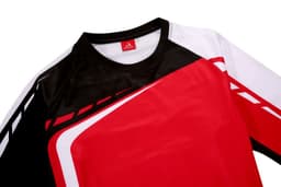 A red, black, and white heavy pullover featuring a sporty design and a logo on the collar.