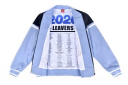 A bomber jacket in light blue and black with a printed interior listing names. It features a logo.