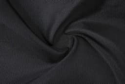 A close-up of black textured fabric, featuring a smooth, woven pattern. The material appears durable and lightweight.