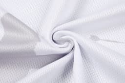 A soft, white mesh fabric with a subtle pattern, ideal for clothing. The material has a slight sheen.