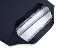 A close-up of a navy blue rugby tee with a white interior lining and neat stitching details.
