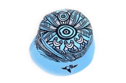 A reversible bucket hat featuring a blue design with intricate black patterns and a logo on the side.