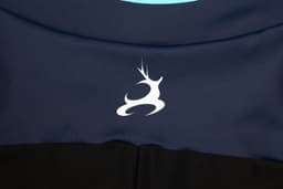 A INLINE speed skating suit in navy blue and black featuring a white logo.