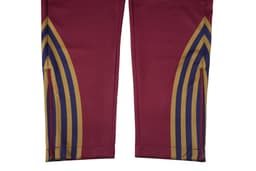 Zipper bottom training pants in maroon, featuring decorative stripes in gold, blue, and red. Includes a small logo.