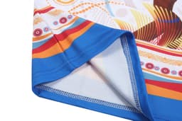 A towel with a vibrant patterned design featuring blue, orange, and red colours and a stitched edge.