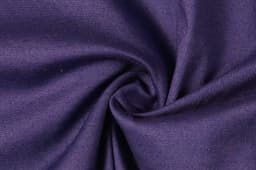 A swirl of textured fabric in deep purple, showcasing a smooth and woven surface.