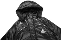 A black jacket with a hood featuring a quilted interior and a logo on the front.
