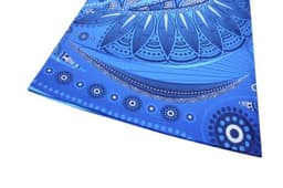 A blue t-shirt featuring intricate, abstract design elements in varying shades of blue. The shirt includes a logo.