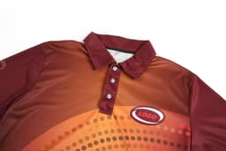 A maroon and orange polo shirt with a collar and three buttons, featuring a logo on the front.