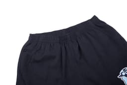 Black shorts featuring an elastic waistband and a graphic design on the side. The shorts have a pocket detail.