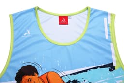 A sports singlet in light blue with a vibrant orange and splash design. Features a logo on the front and bright green trim.