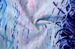 A swirling fabric pattern with blue, pink, and white abstract designs, suitable for beach shirts and shorts.