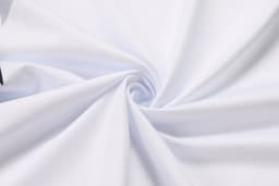 A swirl of smooth, white fabric ideal for swimwear, featuring a soft texture suitable for aquatic activities.