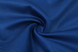 A swirling fabric in a deep blue colour, smooth and slightly reflective. It has a soft texture.