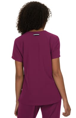 A purple top with short sleeves, designed with a logo on the back. The fabric appears lightweight and relaxed.