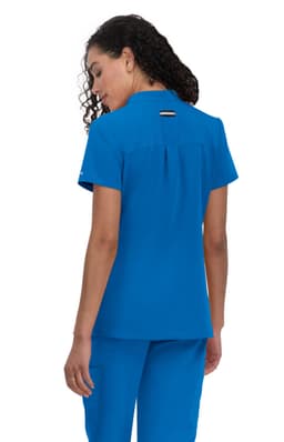 A blue medical scrub top with a back pleat and a logo, featuring short sleeves and a collar.