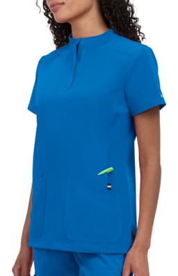 A blue medical scrub top featuring a short collar and two front pockets. The design includes a small accent colour detail.