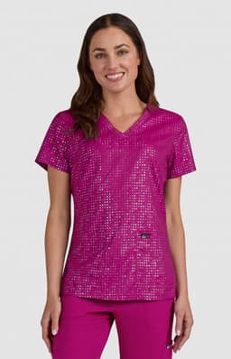 A pink top featuring a sparkling sequin design, with a V-neck and short sleeves, and a logo on the side.