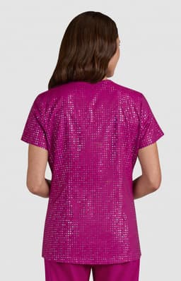 A shiny, pink top with a sequin design, featuring a simple round neckline and short sleeves.