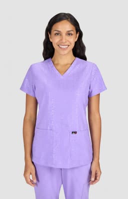 A purple scrub top with a V-neck design, featuring a subtle pattern and a logo on the front.