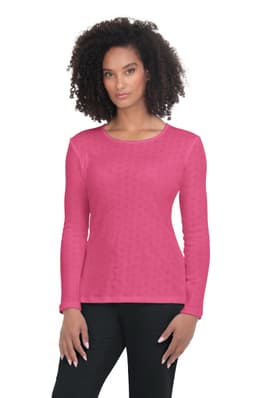 A pink long-sleeve top on a model, featuring a round neckline and a textured pattern. It has a logo on it.