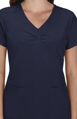 A women's navy blue scrub top featuring a V-neck and short sleeves with two front pockets and a gathered detail.