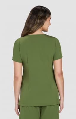 A woman wearing a short-sleeve, olive green top, viewed from the back, against a light grey background.