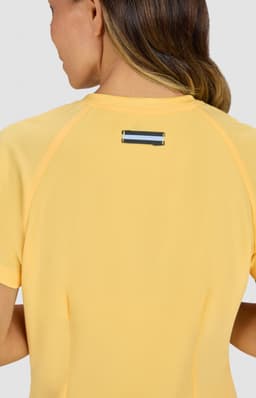 A yellow top with a contrasting logo on the back, featuring short sleeves and a fitted design.
