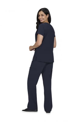 A woman wears a navy blue Sari Top paired with matching navy blue pants, facing slightly to the side.