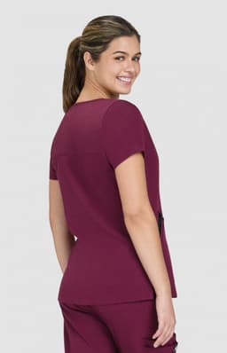 A maroon Sari Top with a classic cut, featuring short sleeves and a back view of the model. Branding is visible.