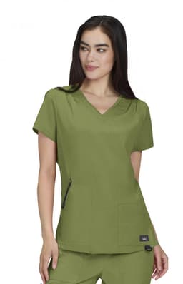 A short-sleeved, olive green medical scrub top with a V-neck and two front pockets. The top features a logo.