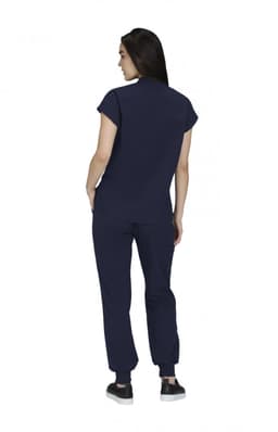 A woman wearing a navy blue top and matching pants, viewed from the back. The outfit features a soft fabric and modern design.