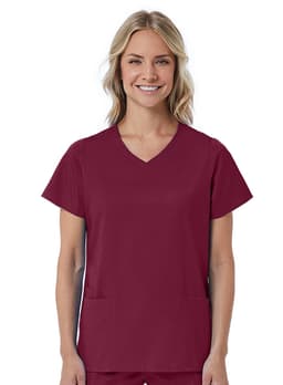 A womans mock wrap top in a rich burgundy colour with short sleeves and two front pockets. It features a logo.